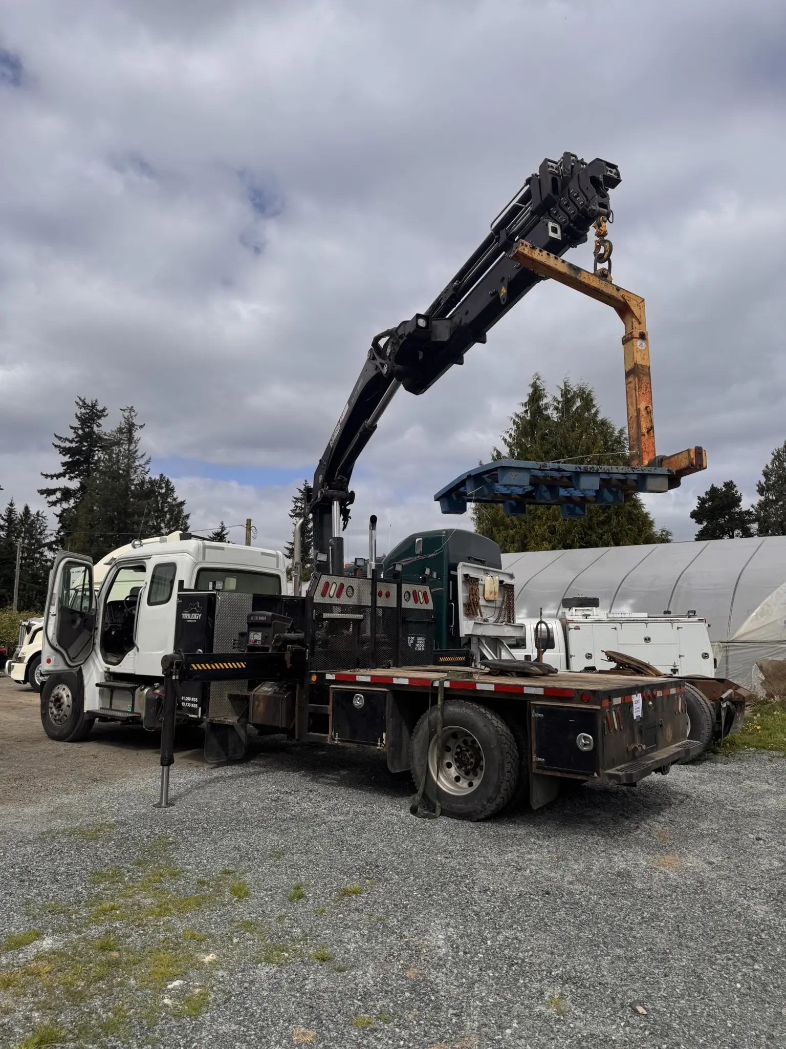 Crane truck lifting equipment on a job site
